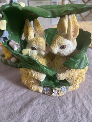 Vintage bunnies under a leaf