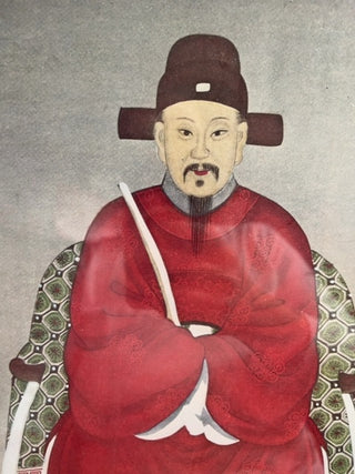 Sitting Asian man, framed glass