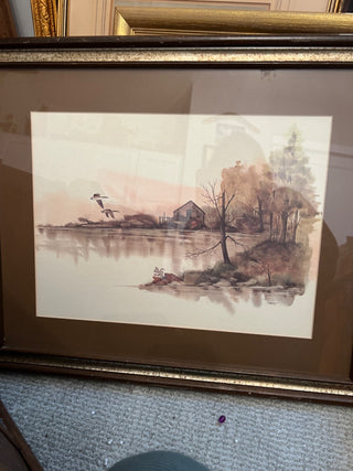 Watercolor of cabin by lake