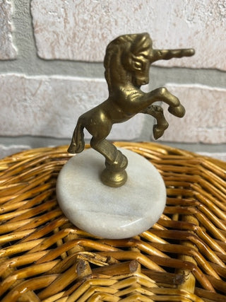 Brass unicorn on marble base