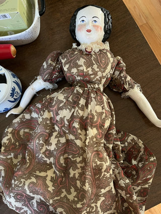 Porcelain Doll in Brown Dress