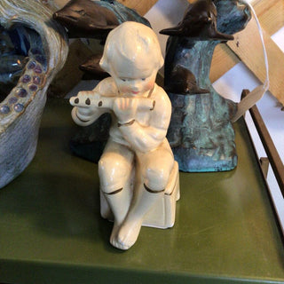 Boy with flute chalkware