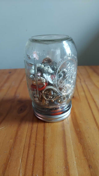 FIRM. Miscellaneous vintage large jewelry jar