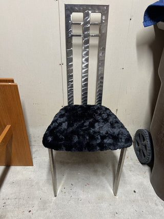 Brushed steel 80s modernist chair with continuous back