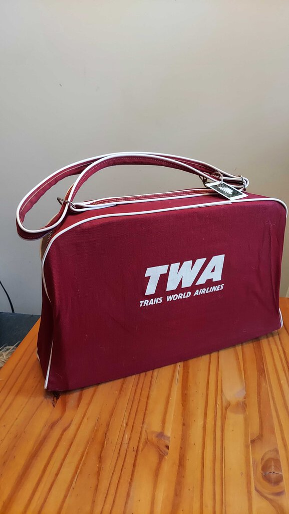 FIRM - 1950s, TWA (Trans World Airlines) red canvas flight bag with white piping. Airliner Carry on Travel Tote Bag.
