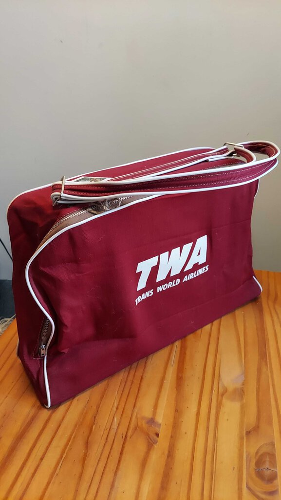 FIRM - 1950s, TWA (Trans World Airlines) red canvas flight bag with white piping. Airliner Carry on Travel Tote Bag.