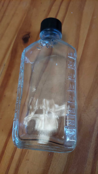 Embossed Clear Glass Medicine pharmaceutical Bottle 3iv by Moderne Oval