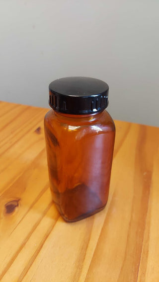 4oz 1951 Amber glass apothecary pharmaceutical bottle by Armstrong Cork Company
