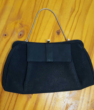 1950s Black Evening Clutch with modern bow front and convertible chain. (T&M)